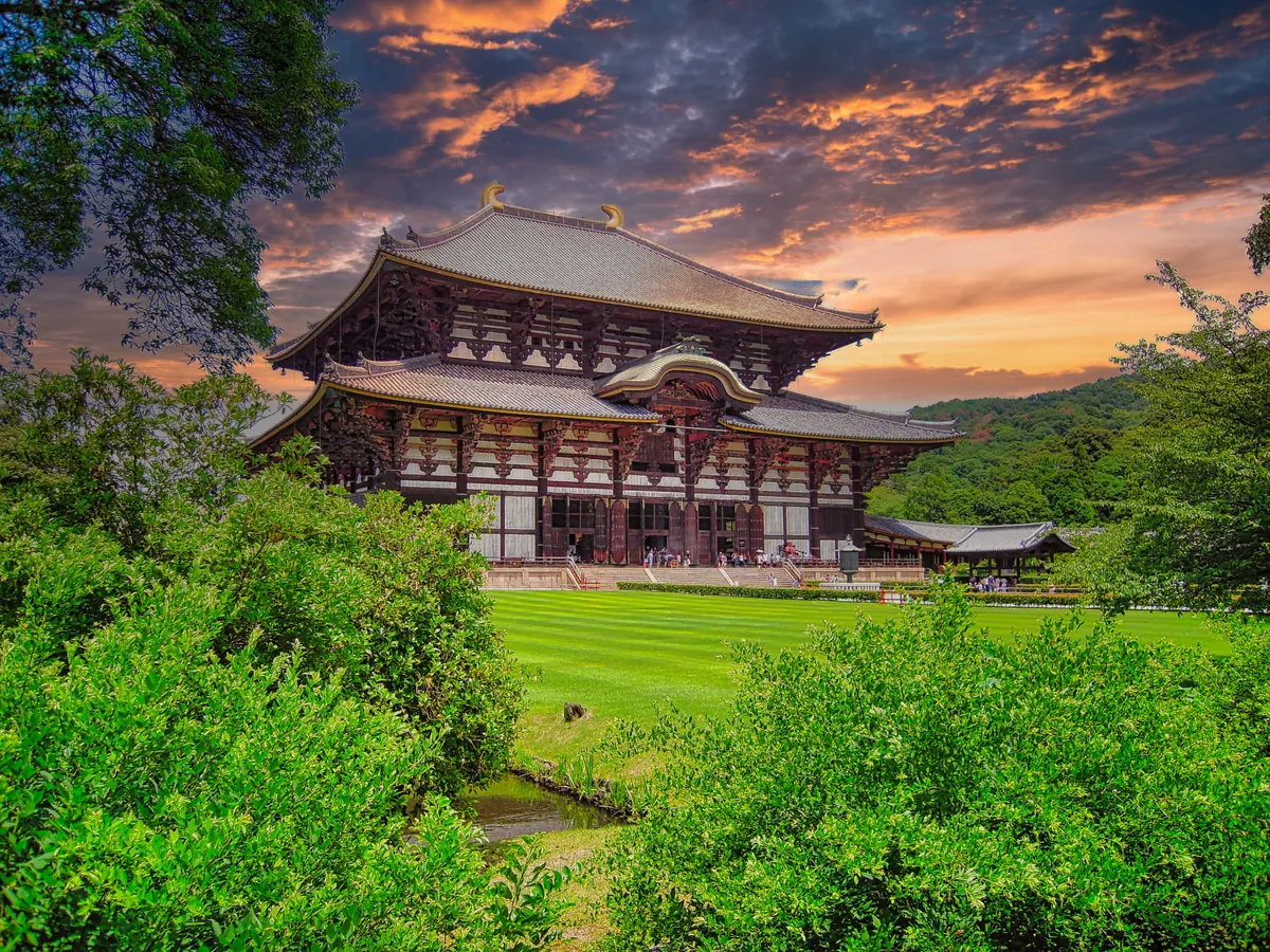 The broad wooden facade and tiled roof of Todai-ji Great Buddha Hall, framed by trees