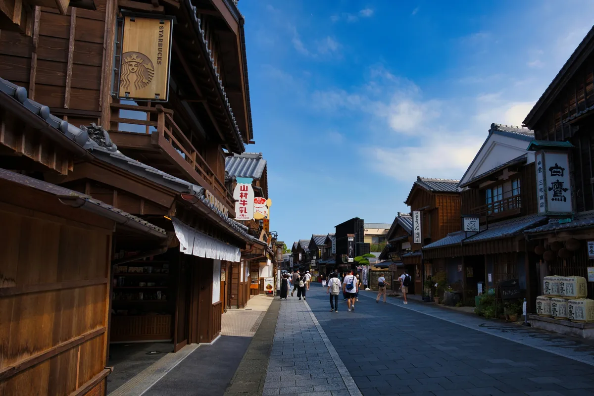 Traditional wooden shopfronts lining a broad pedestrian street in Oharaimachi