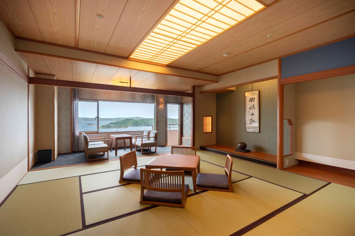 An official Rankei Japanese-style room example with tatami flooring, a low table and bay-view seating